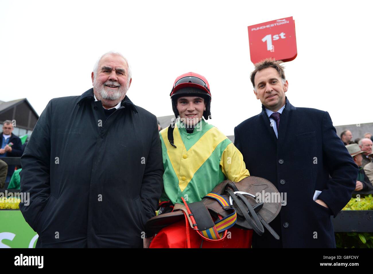 Owner Alan Potts with jockey Jonathan Burke and Henry de Bromhead after Sizing John won The Ryans Cleaning Craddockstown Novice Chase during day two of the Winter Festival at Punchestown Racecourse, Co. Kildare, Ireland. Stock Photo