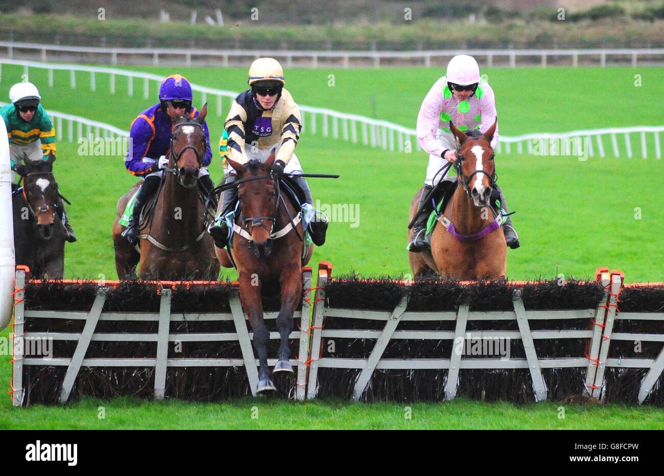 Nichols Canyon ridden by David Mullins (second right) jumps the last ahead of Faugheen ridden by Ruby Walsh (right) to win the StanJames.com Morgiana Hurdle during day two of the Winter Festival at Punchestown Racecourse, Co. Kildare, Ireland. Stock Photo