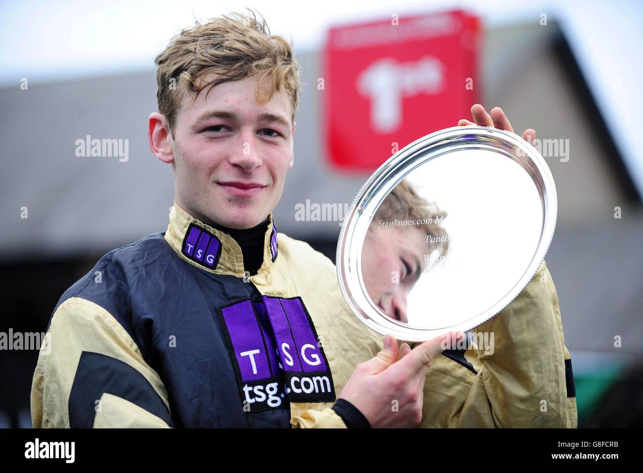 Jockey David Mullins with the trophy after winning the StanJames.com Morgiana Hurdle onboard Nichols Canyon during day two of the Winter Festival at Punchestown Racecourse, Co. Kildare, Ireland. Stock Photo