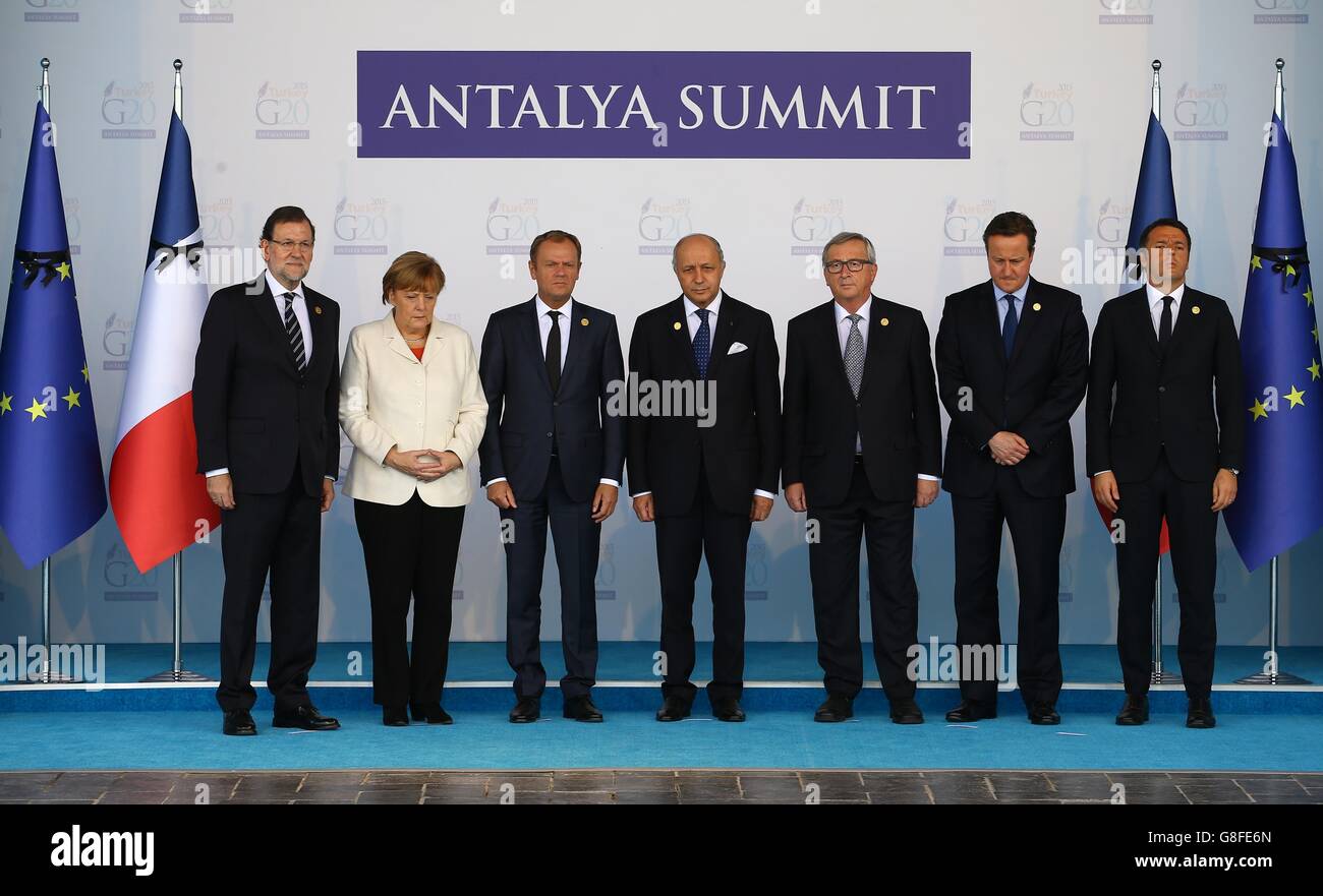 (left to right) Spanish Prime Minister Mariano Rajoy Brey, German Chancellor Angela Merkel, President of the European Council Donald Tusk, French Foreign Minister Laurent Fabius, European Commission President Jean-Claude Juncker, Prime Minister David Cameron and Italian Prime Minister Matteo Renzi observing a minute silence for the Paris terror attack victims during the G20 Summit of world leaders at Antalya in Turkey. Stock Photo