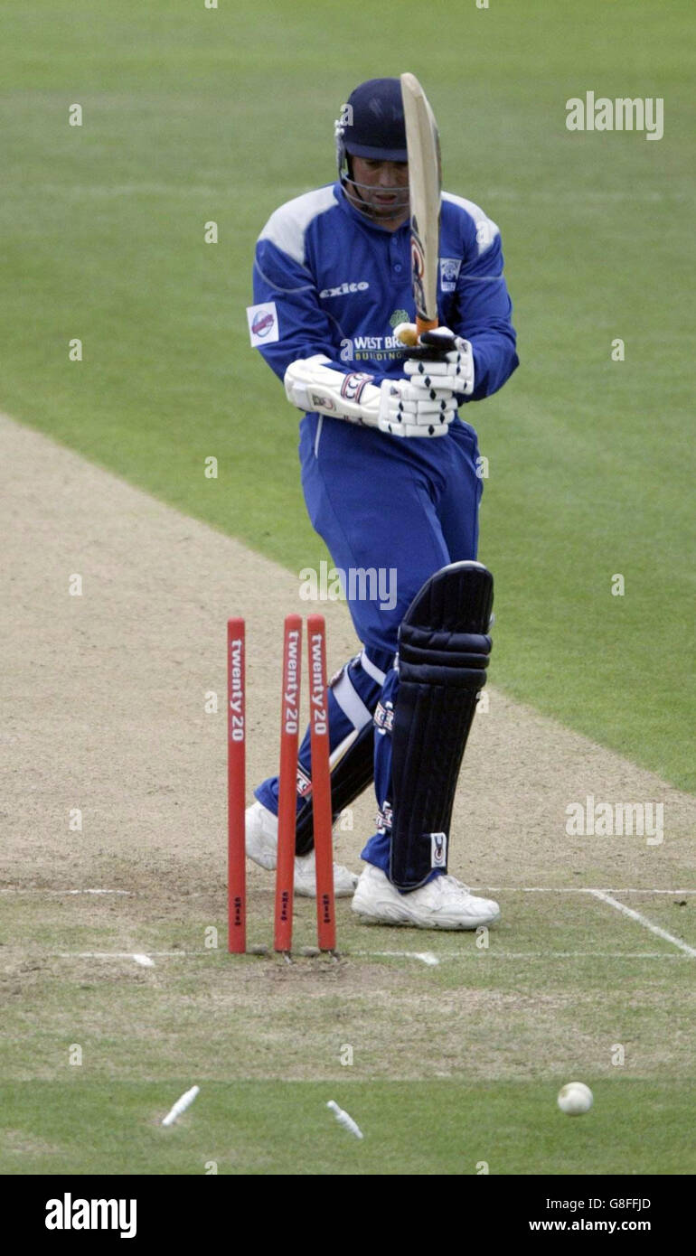 Warwickshire Bears batsman Neil Carter looks around to see he has been bowled. Stock Photo