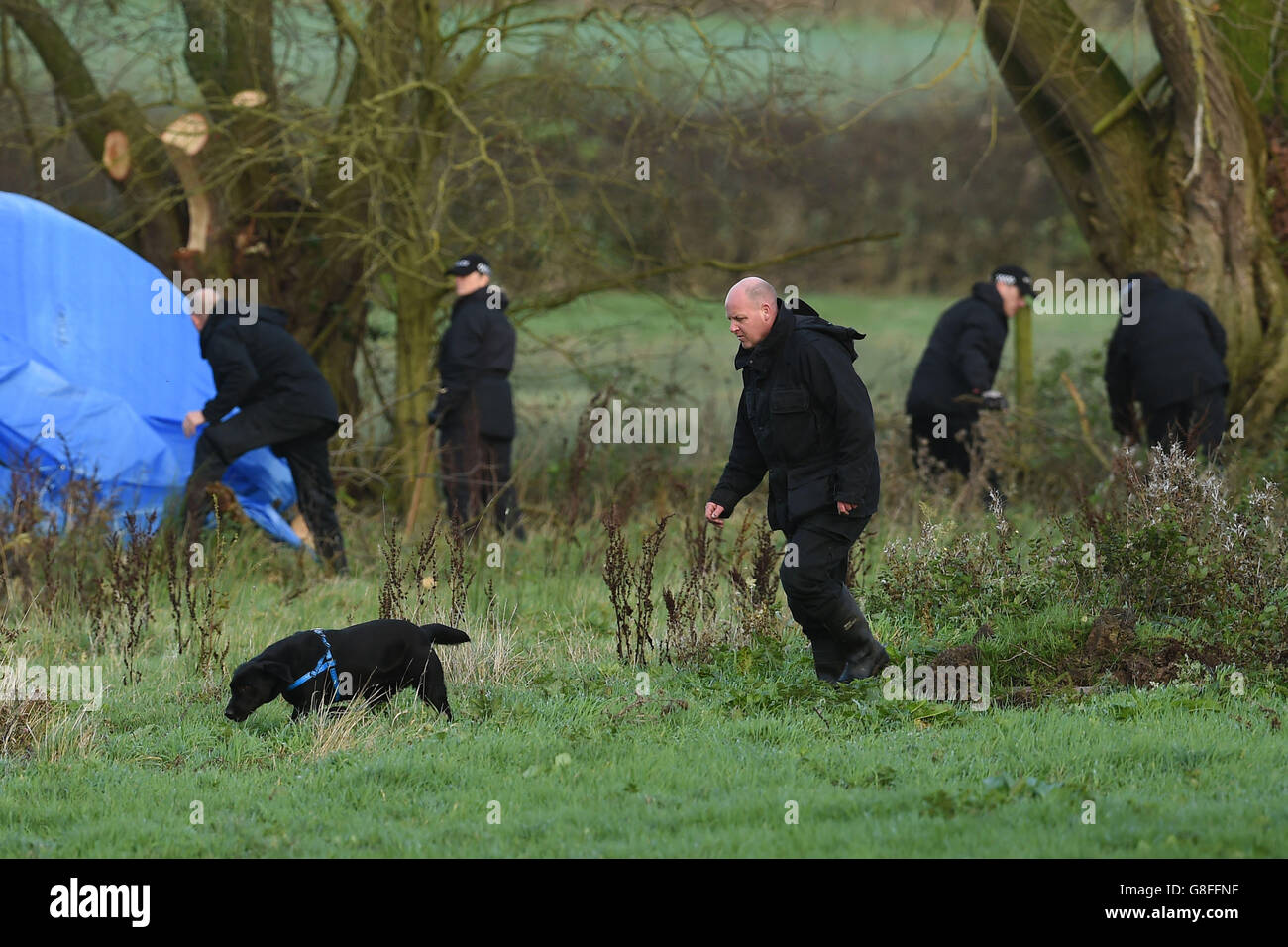 Police search a field off Ashby Road in Belton, Leicestershire, for