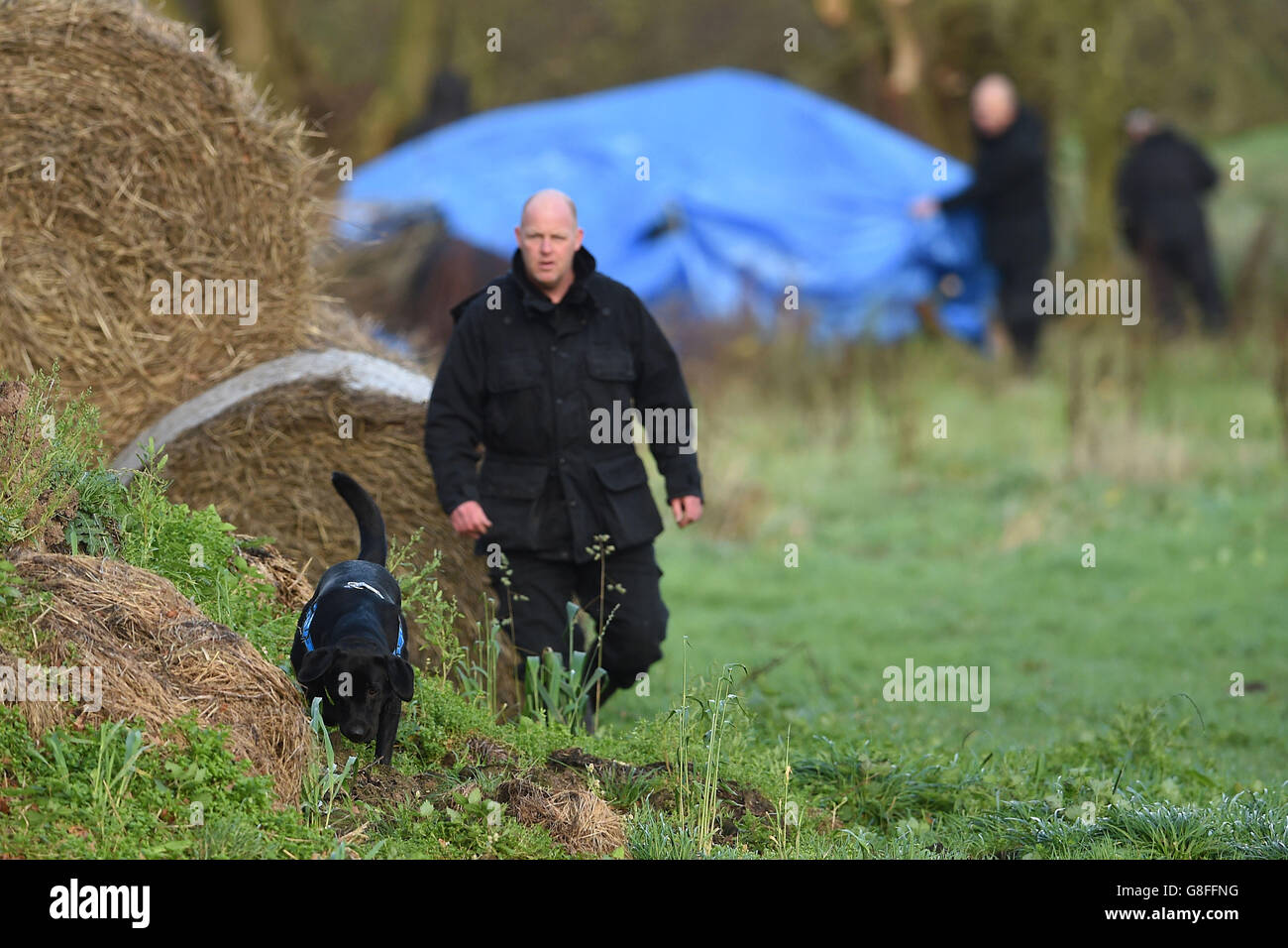 Police search a field off Ashby Road in Belton, Leicestershire, for