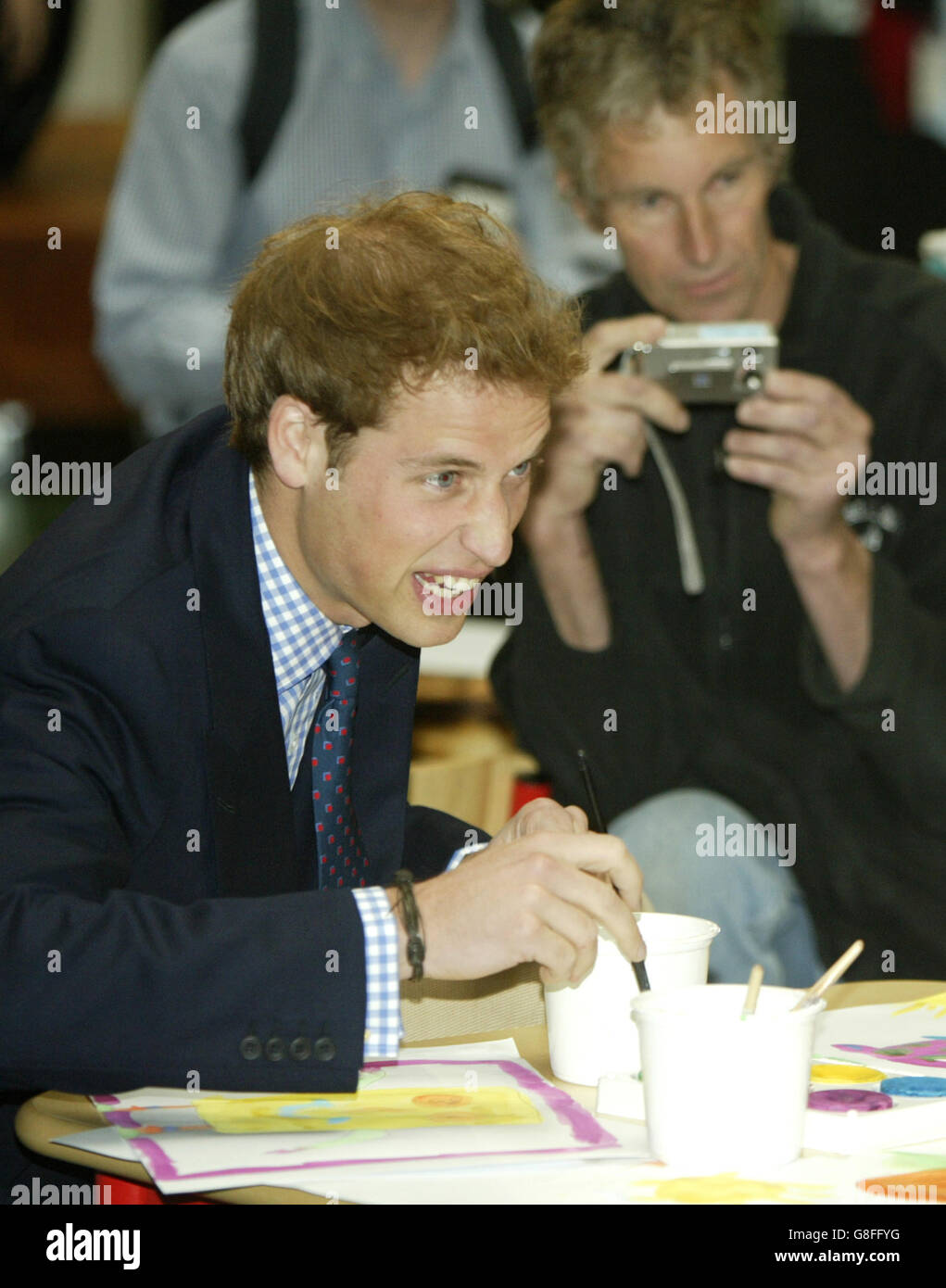 Prince William talks and paints with young patients during a visit to Auckland's Starship Childrens Hospital. Stock Photo