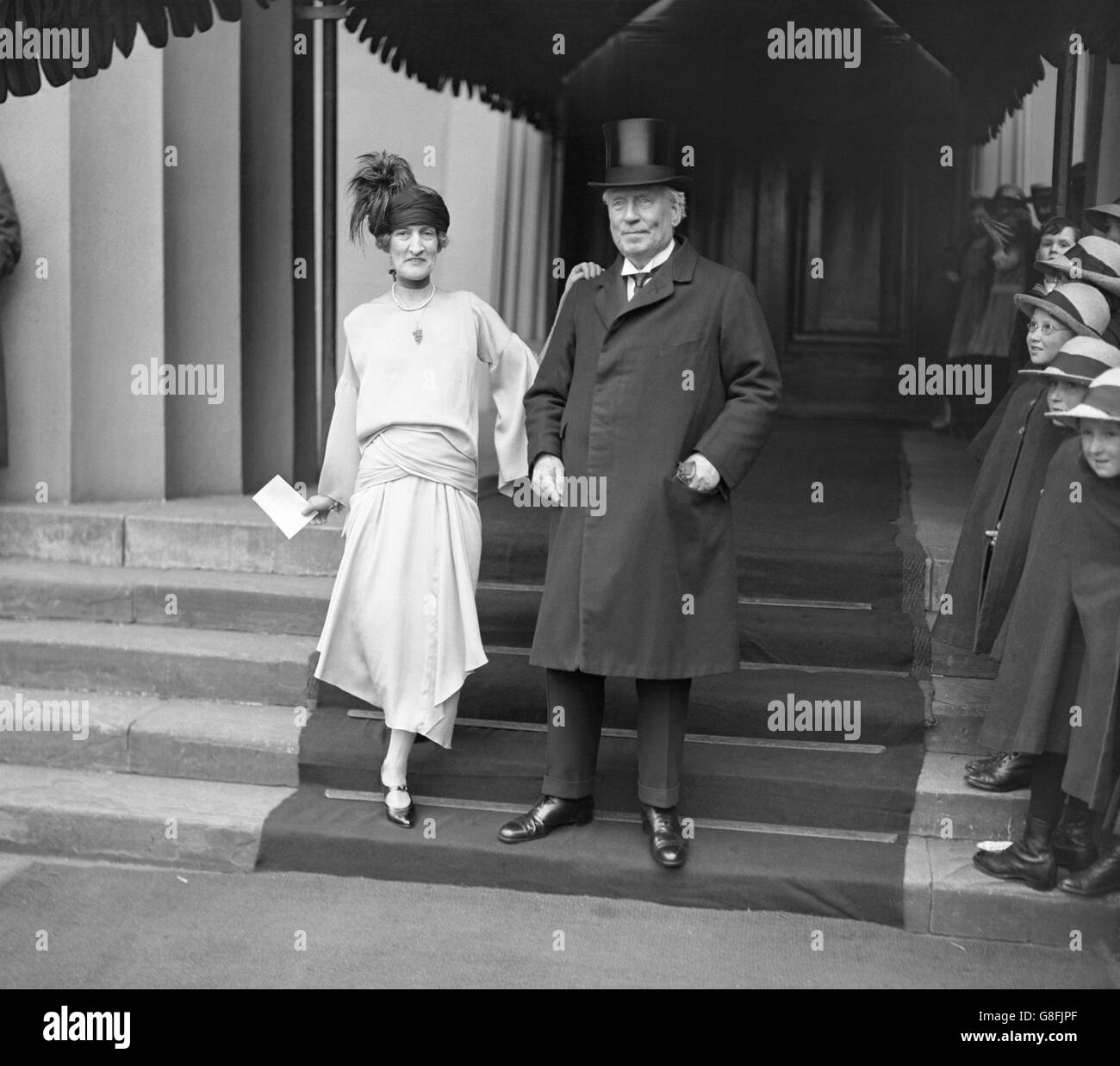 Leader of the Liberal party and former Prime Minister H. H. Asquith, with Mrs Asquith, leaving the wedding of the Hon. Diamond Hardinge and Capt. R Abercromby MC at the Guards Chapel in Wellington Barracks, London. Stock Photo