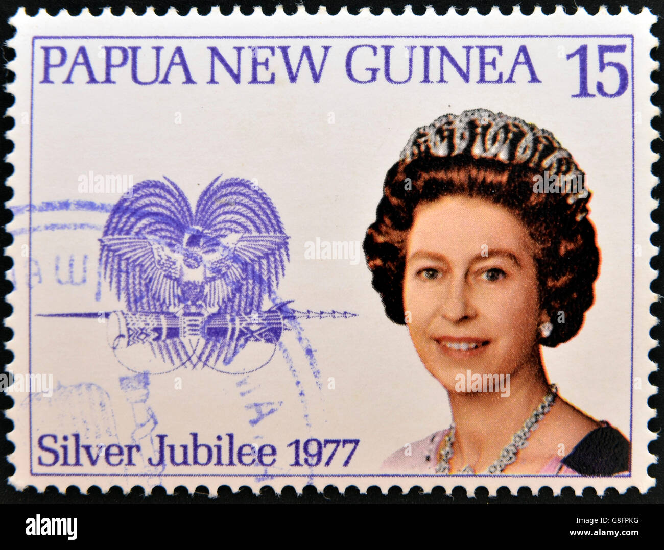 PAPUA NEW GUINEA - CIRCA 1977: stamp printed in Papua New Guinea shows aportrait elizabeth II, silver jubilee in commemoration, Stock Photo