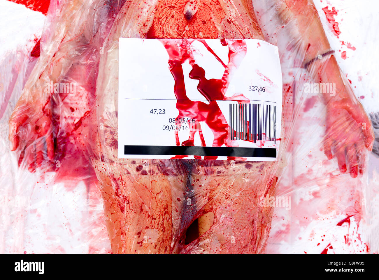 Vegans and vegetarians animal rights activists covered themselves in blood and wrapped themselves in meat packaging protesting a Stock Photo