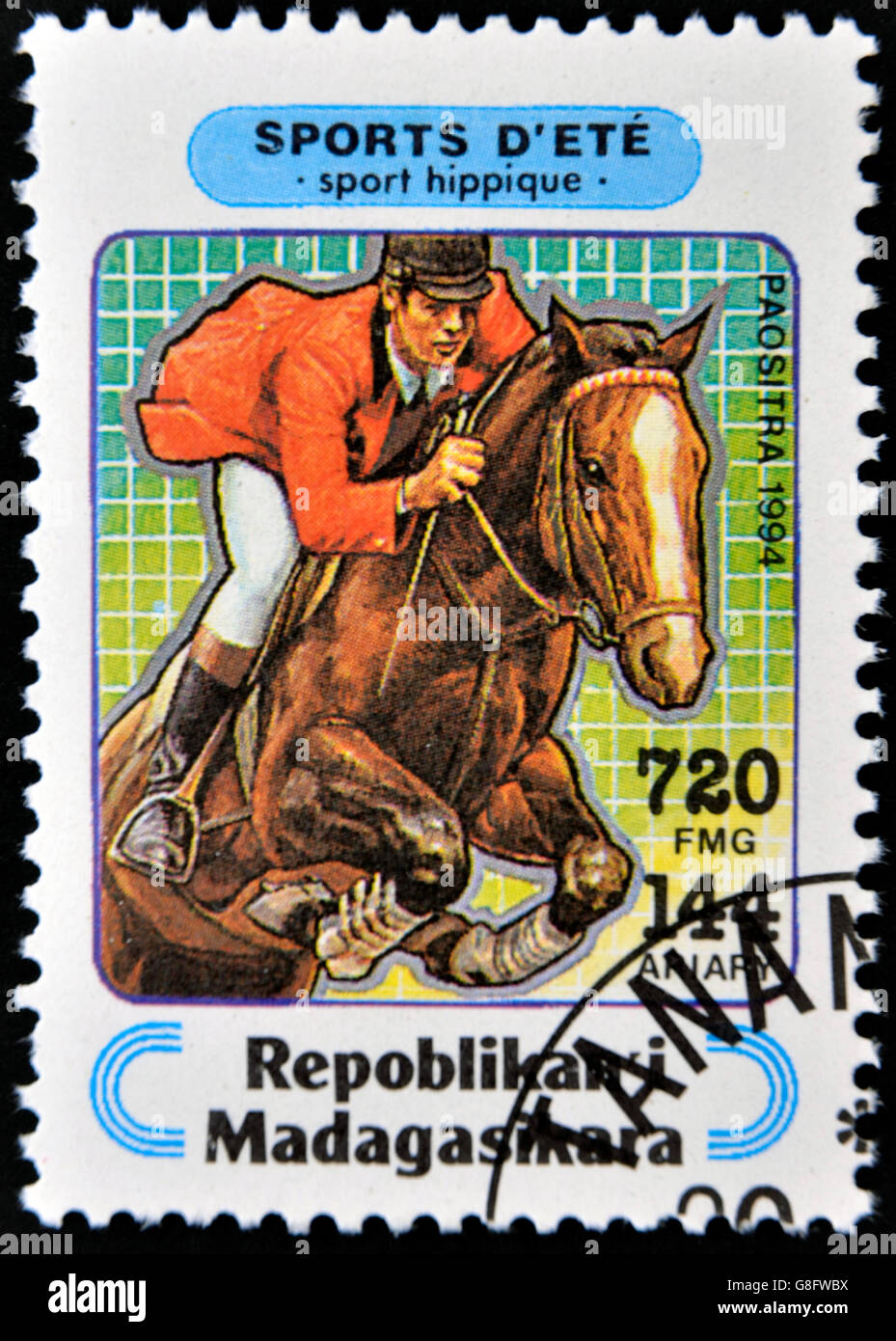 MADAGASCAR - CIRCA 1994: A stamp printed in Madagascar dedicated to summer sports shows  Equestrianism, circa 1994 Stock Photo
