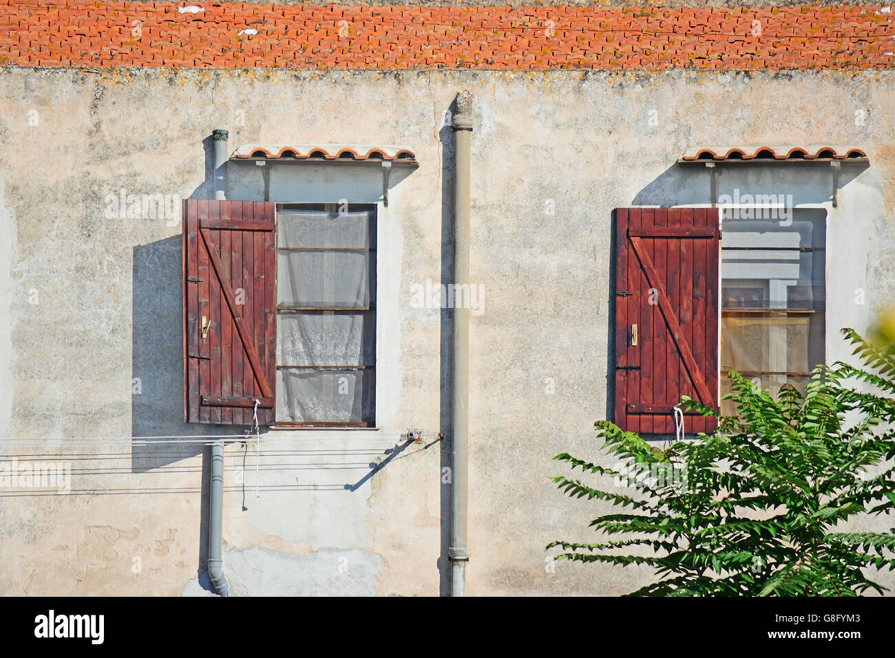 two old windows in Alghero, Sardinia Stock Photo