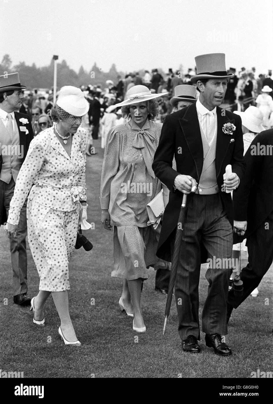 The Prince and Princess of Wales walk through the paddock at the Royal