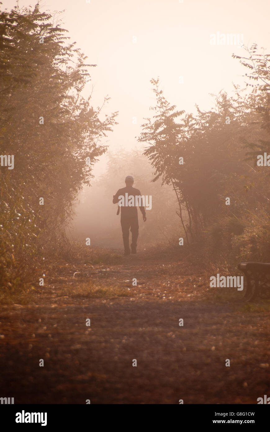 Man walking alone in morning hi-res stock photography and images - Alamy