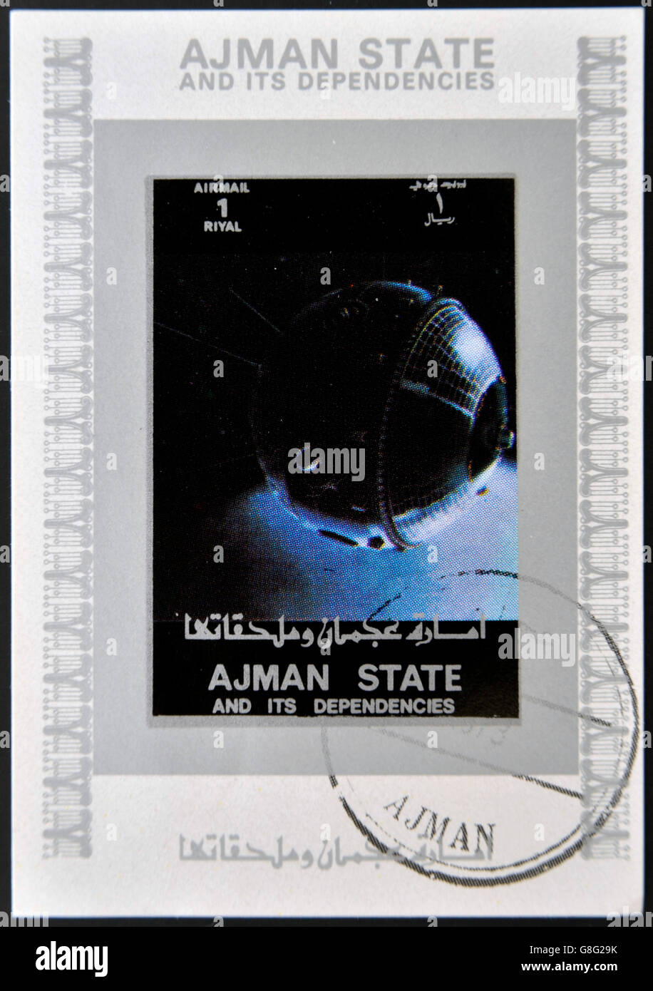 AJMAN STATE - CIRCA 1973: A stamp printed in United Arab Emirates (UAE) shows Explorer 17 series satellites, circa 1973 Stock Photo