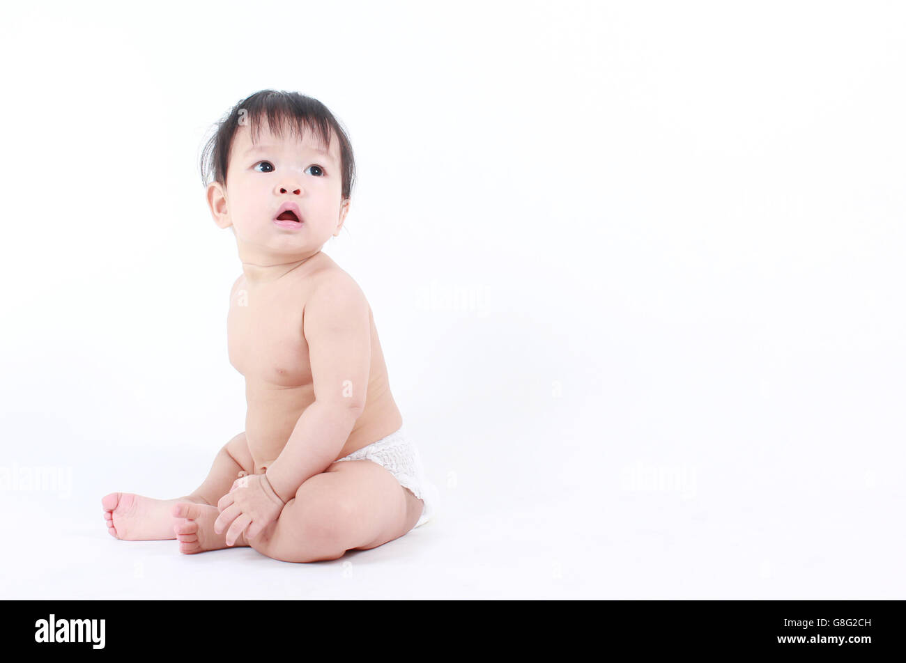 Portrait of little cute baby on a white background Stock Photo - Alamy