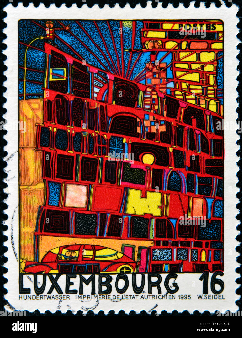 LUXEMBOURG - CIRCA 1995: A stamp printed in Luxembourg shows the House with the Arcades and the Yellow Tower by Hundertwasser, c Stock Photo