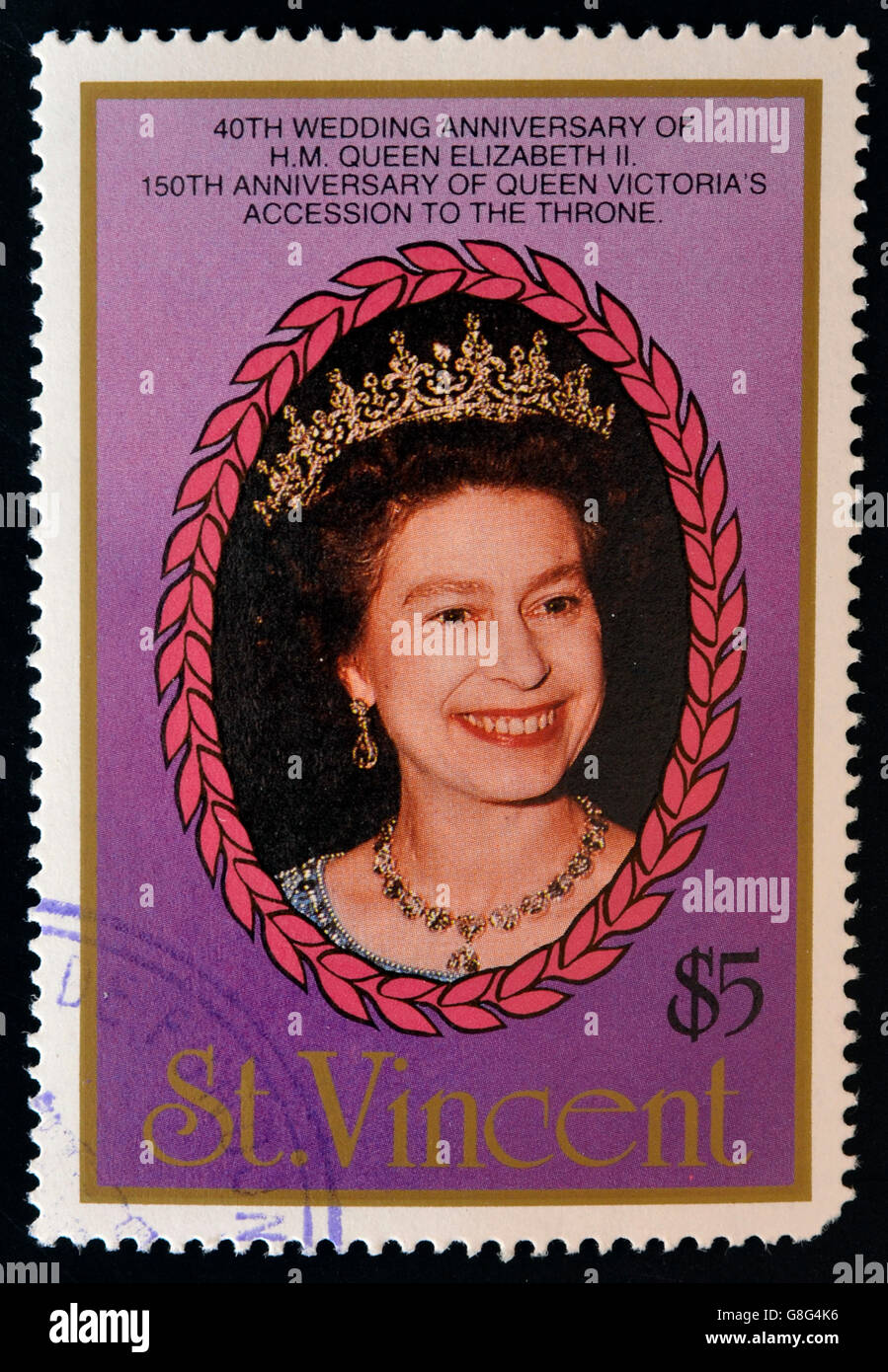 ST. VINCENT - CIRCA 1987: A stamp printed in St. Vincent shows portrait of Queen  Elizabeth II, 40th anniversary of Queen Elizab Stock Photo