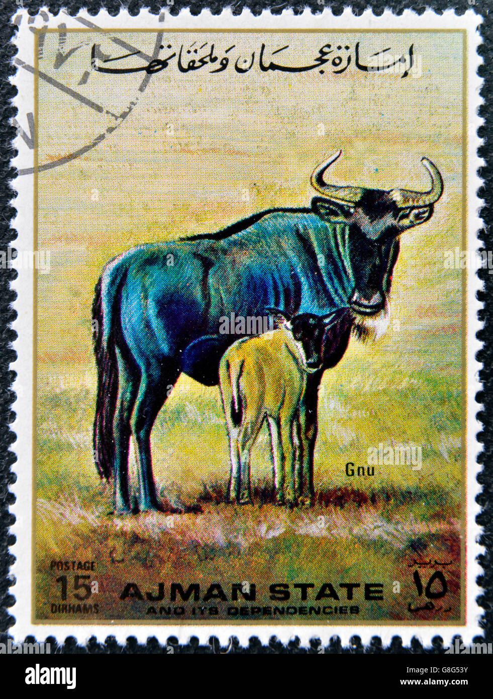MANAMA AJMAN - CIRCA 1967: a stamp printed in Ajman shows Gnu, circa 1967 Stock Photo