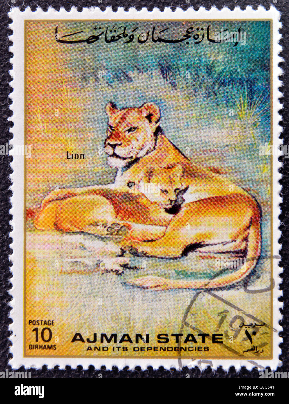 MANAMA AJMAN - CIRCA 1967: a stamp printed in Ajman shows Lion, circa 1967 Stock Photo
