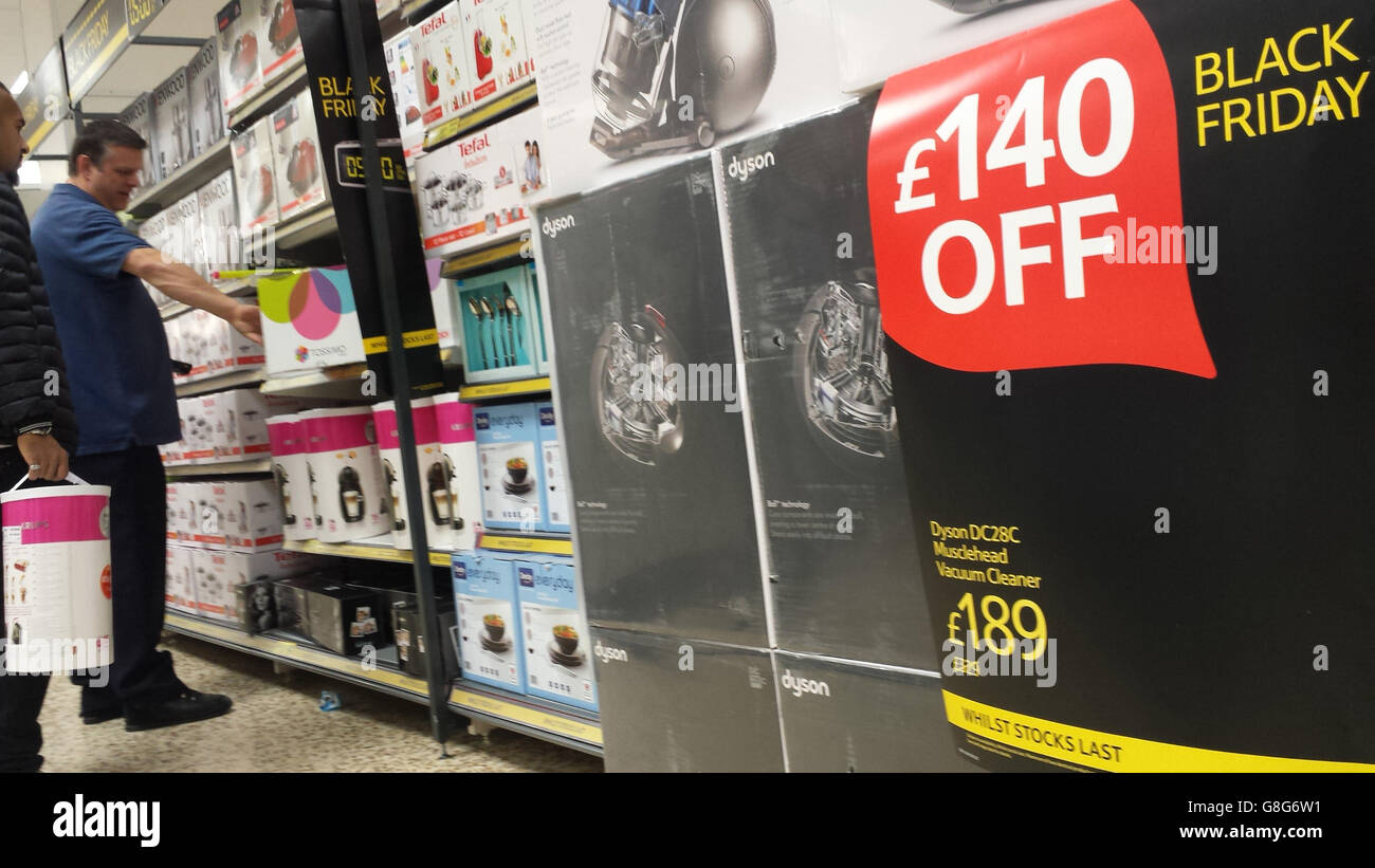 Shoppers in the Tesco Extra store in Surrey Quays, London, looking for Black Friday deals. Stock Photo