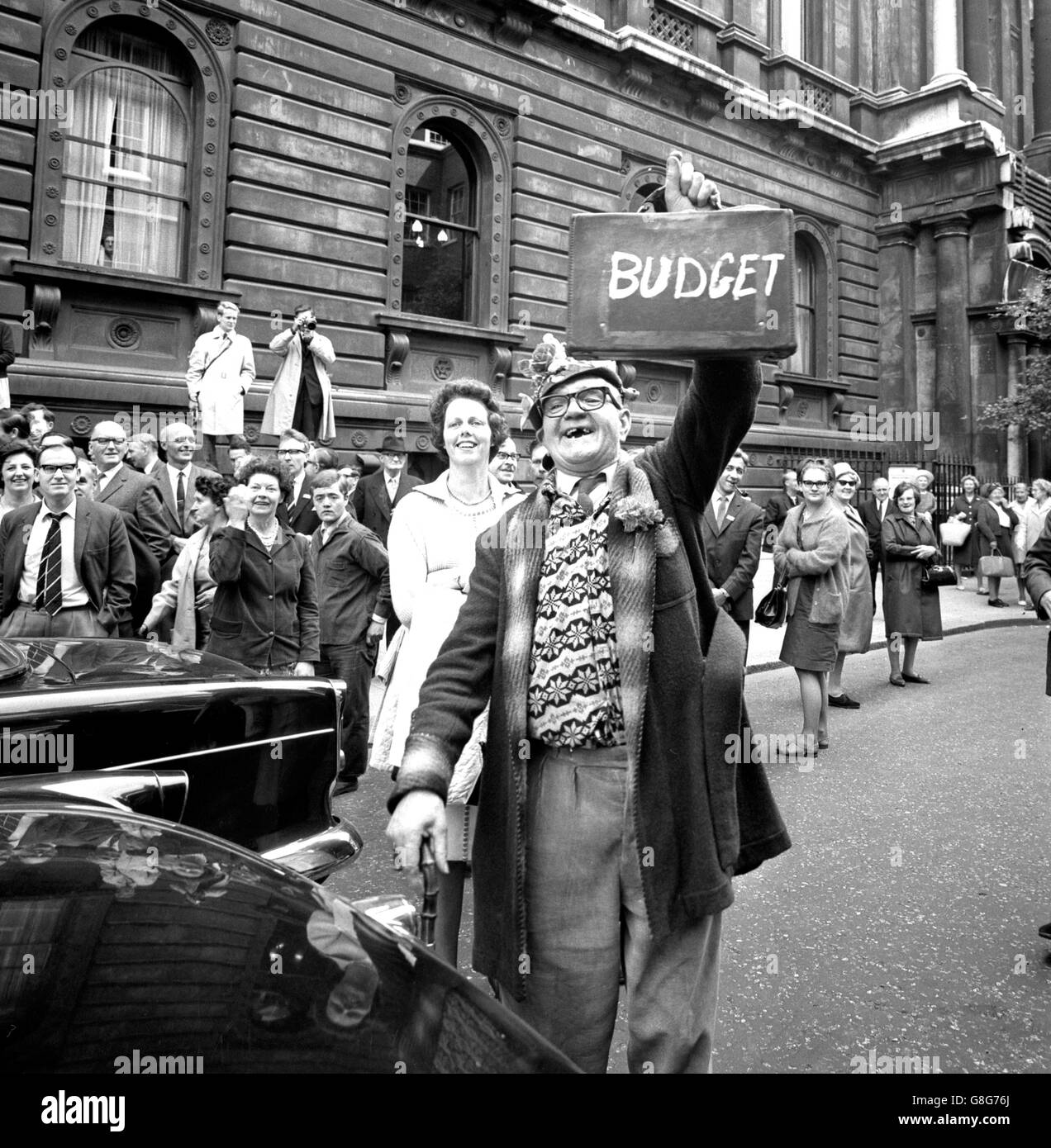 The Chancellor of the Exchequer no longer raises his Budget box for photographers when he sets off for the House of Commons on Budget Day, but Ernest Stokes of Bethnal Green revived the tradition in Downing Street. He was in the crowd that gave a send-off to James Callaghan, when he left No. 11 to make his Budget speech in the House. Stock Photo