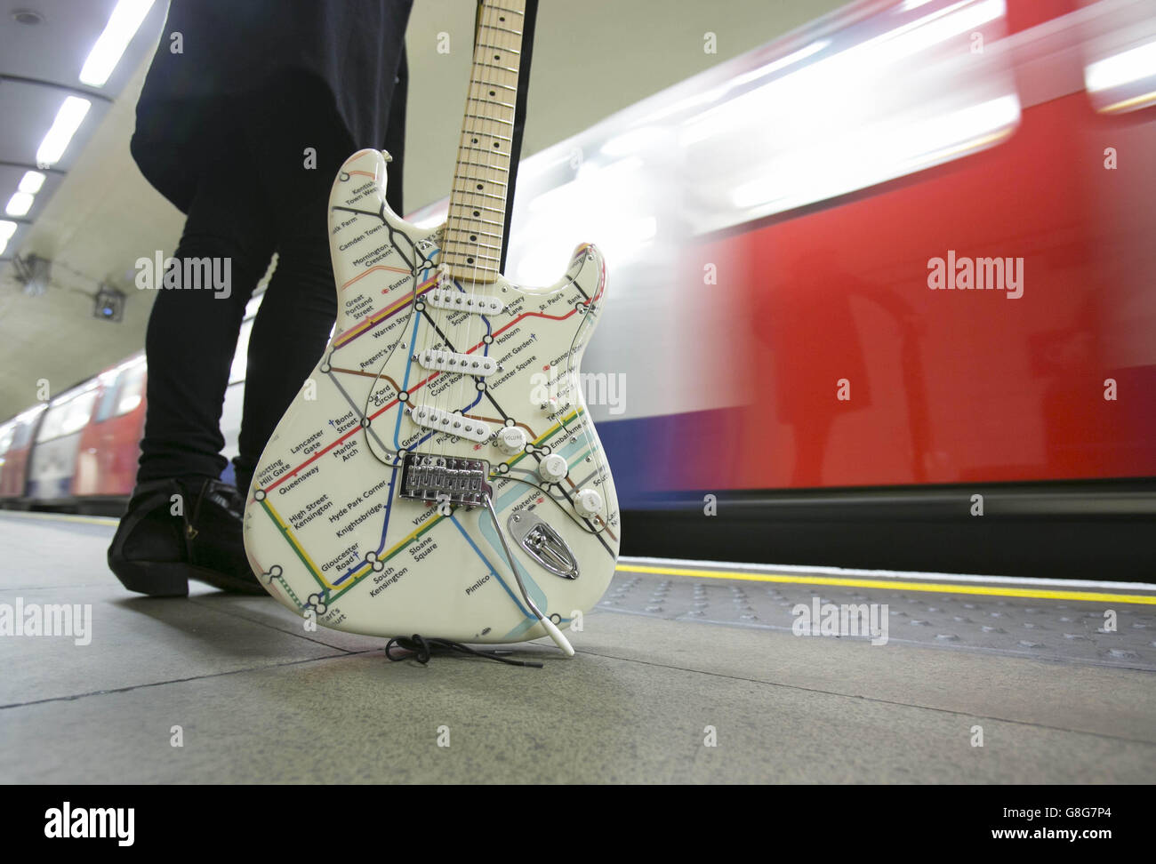 EDITORIAL USE ONLY Musician James Black unveils a special edition Fender Stratocaster guitar illustrated with the London Underground map at St John's Wood Tube station, to celebrate Transport for London and the London Transport Museum's Transported by Design programme. Stock Photo