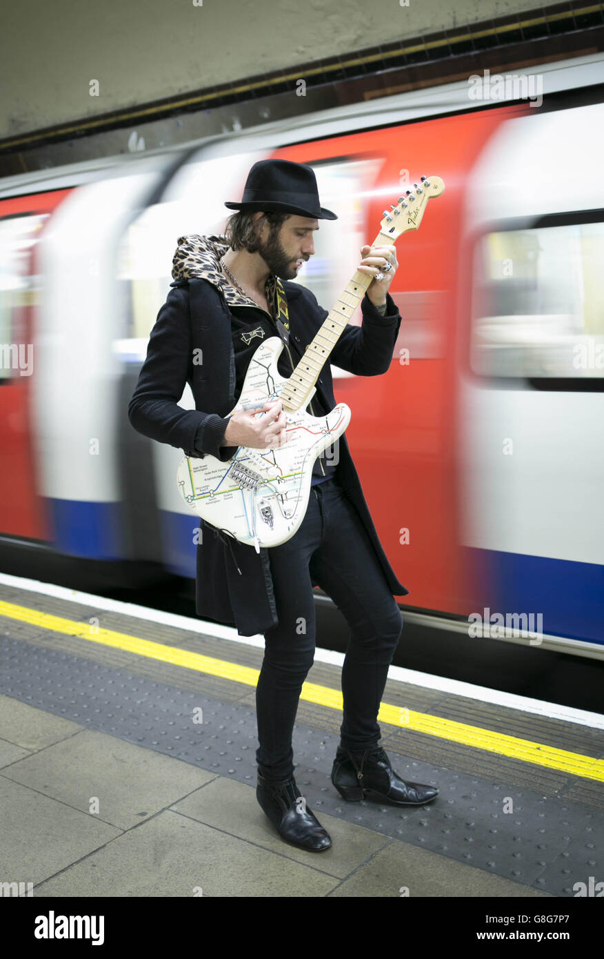 Musician James Black unveils a special edition Fender Stratocaster guitar illustrated with the London Underground map at St John's Wood Tube station, to celebrate Transport for London and the London Transport Museum's Transported by Design programme. Stock Photo