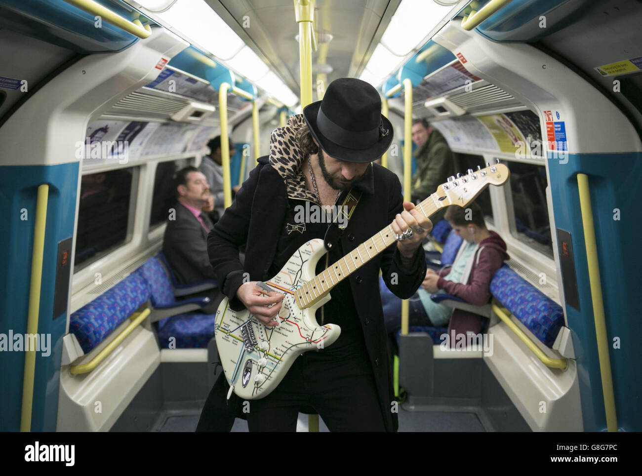 Musician James Black unveils a special edition Fender Stratocaster guitar illustrated with the London Underground map, to celebrate Transport for London and the London Transport Museum's Transported by Design programme. Stock Photo