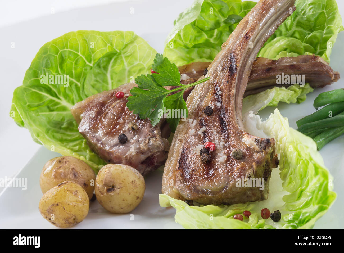 Roasted lamb chops with herbs and pepper Stock Photo Alamy