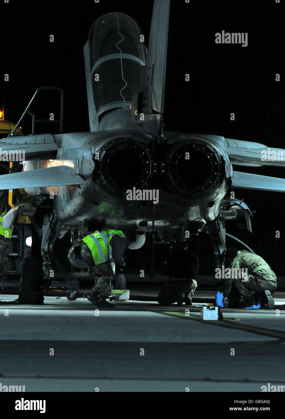 Ground crew work on a RAF Tornado GR4 after it returned to RAF Akrotiri in Cyprus, as jets carried out the first British bombing runs over Syria, the Ministry of Defence confirmed. Stock Photo