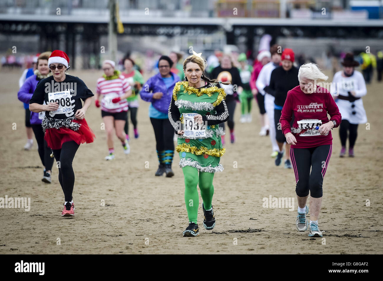 Runners dress up in festive costumes as they take part in the Weston