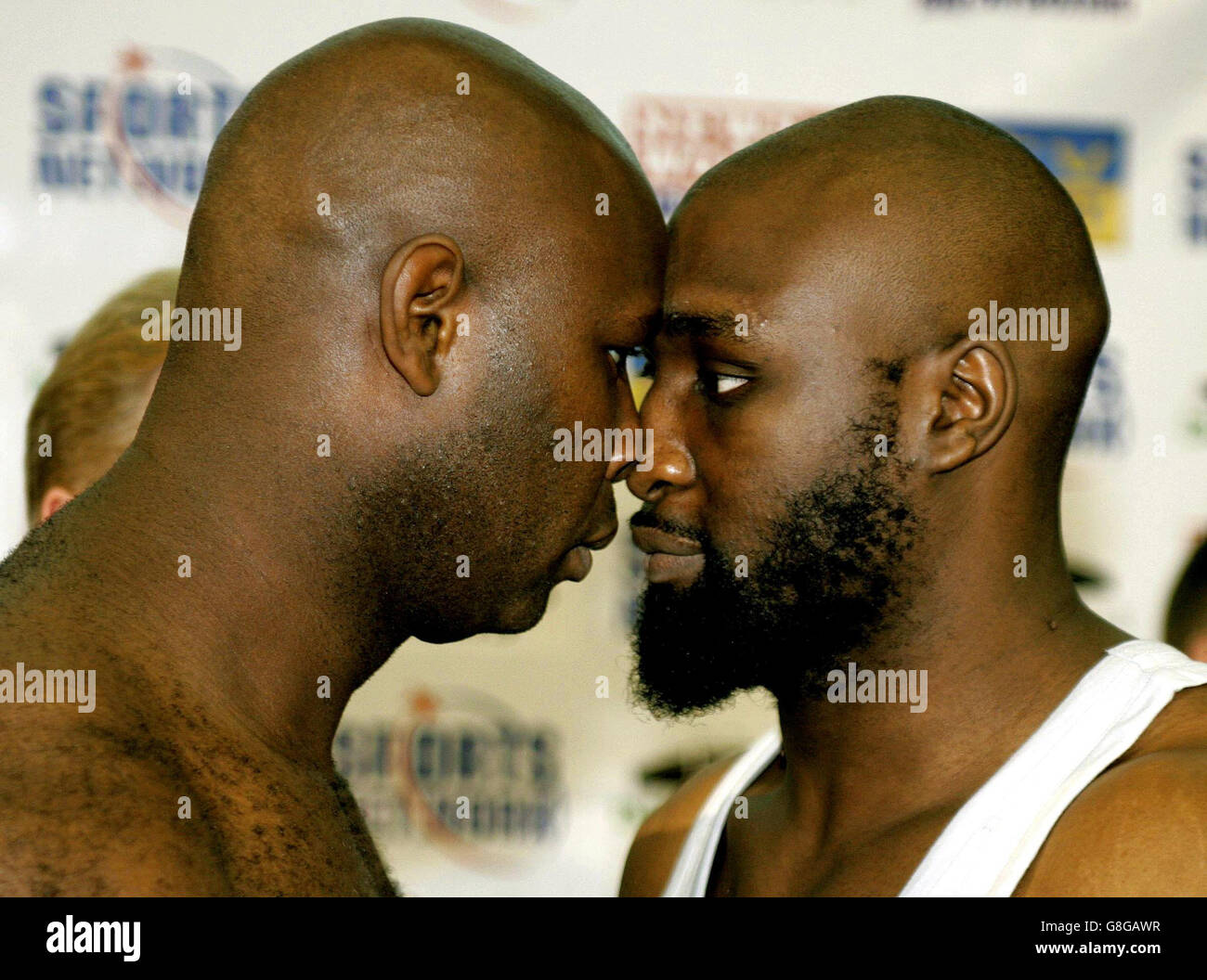Great Britain's Danny Williams (R) and Matt Skelton square up during their weighin ahead of