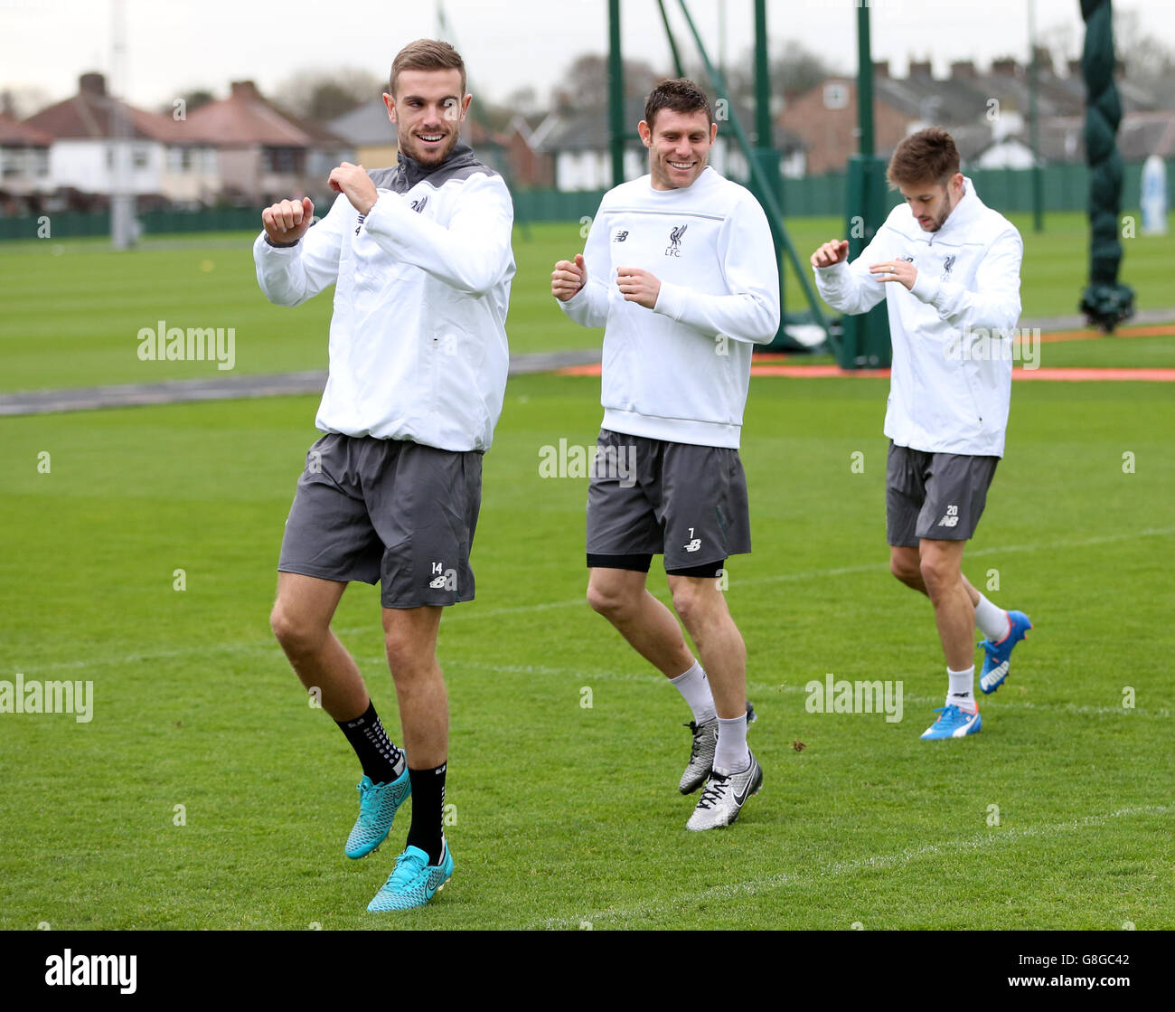 Liverpool's (left to right) Jordan Henderson, James Milner and Adam Lallana during the training session at Melwood Training Ground, Liverpool. Stock Photo