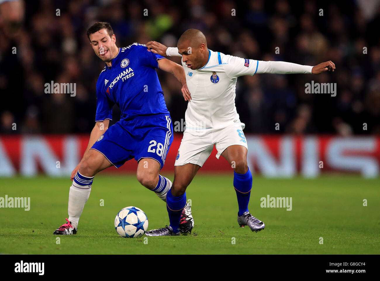 Chelsea's Cesar Azpilicueta (left) and Porto's Yacine Brahimi battle for the ball during the UEFA Champions League match at Stamford Bridge, London. Stock Photo