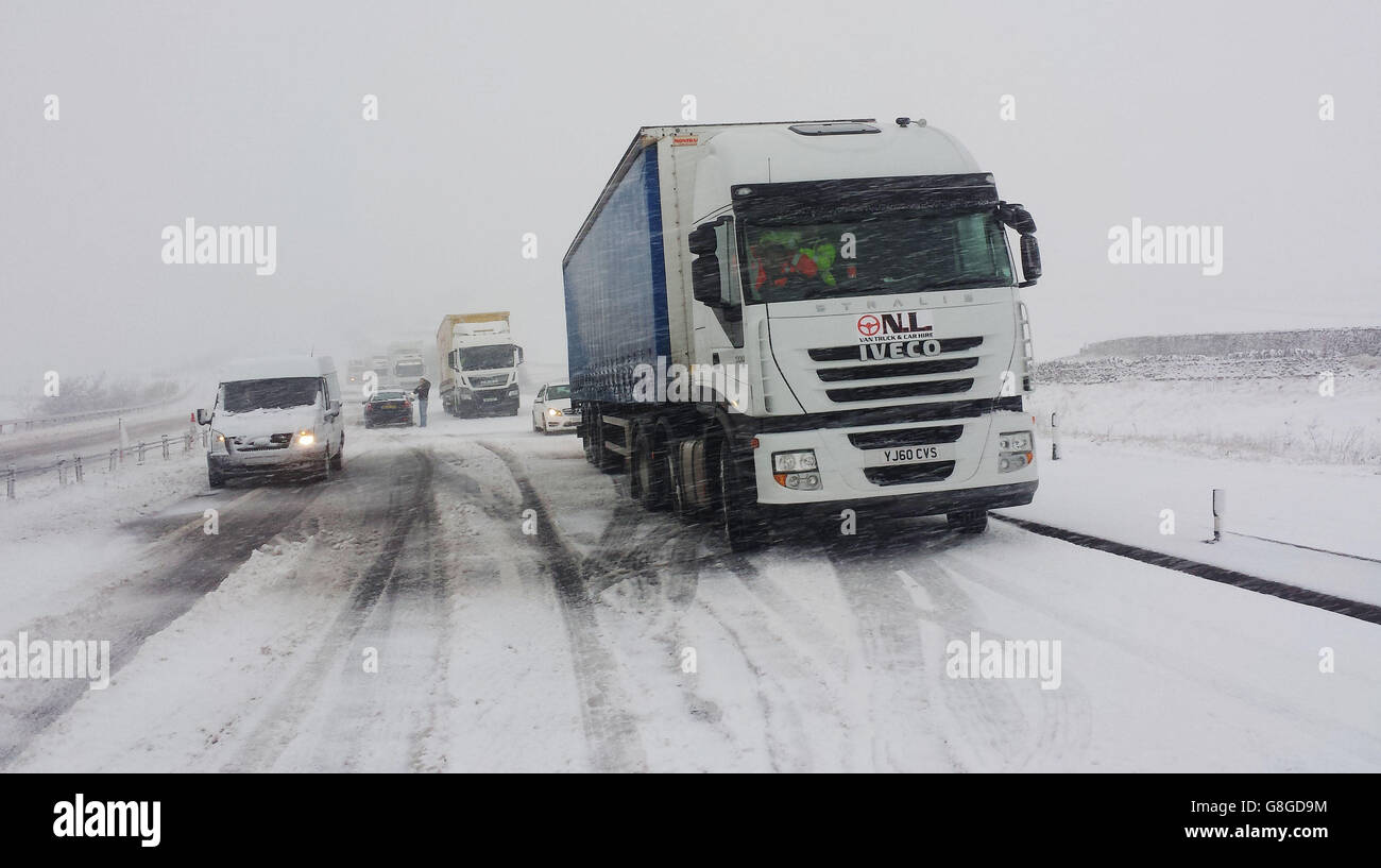 Drivers make their way along the snow covered A66 at Stainmore in Cumbria, as the already flood-hit county is preparing for a second weekend of potential flooding as more rain is expected to hit the north of England. Stock Photo