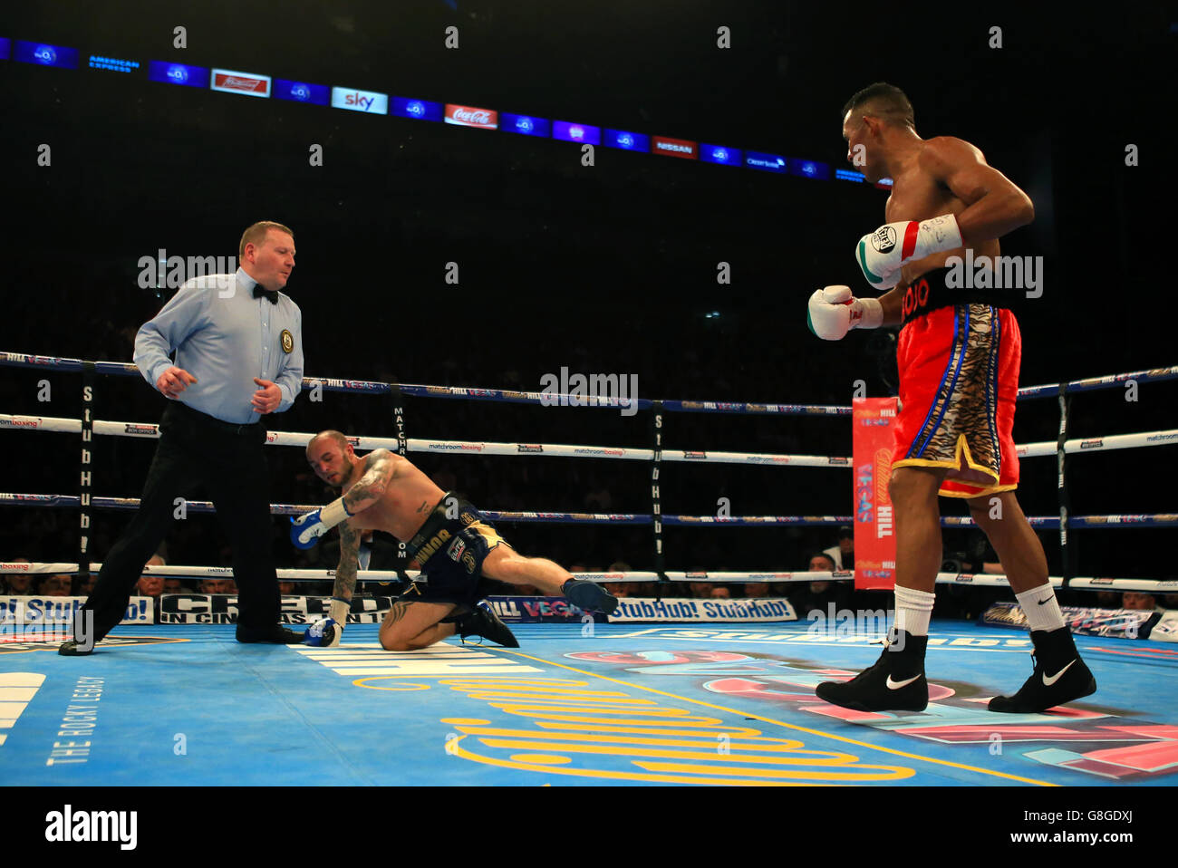 Kevin Mitchell is knocked down by Ismael Barroso during the interim WBA World lightweight title bout at the O2 Arena, London. Stock Photo