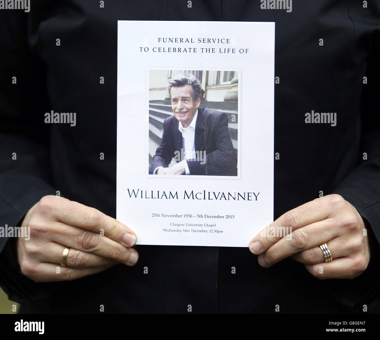 A person holds the order of service from the funeral of William