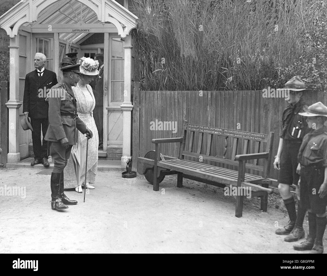 King George V and Queen Mary look at a garden chair made at the Village Centre for the Disabled at Enham. A replica of this was sent to Princess Mary as a wedding present. Stock Photo