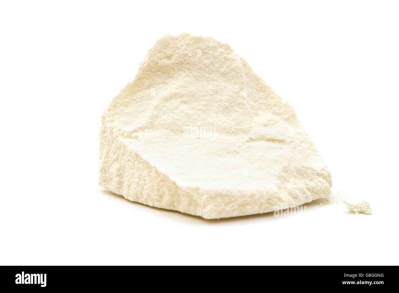 solid block of powdered milk on white Stock Photo Alamy