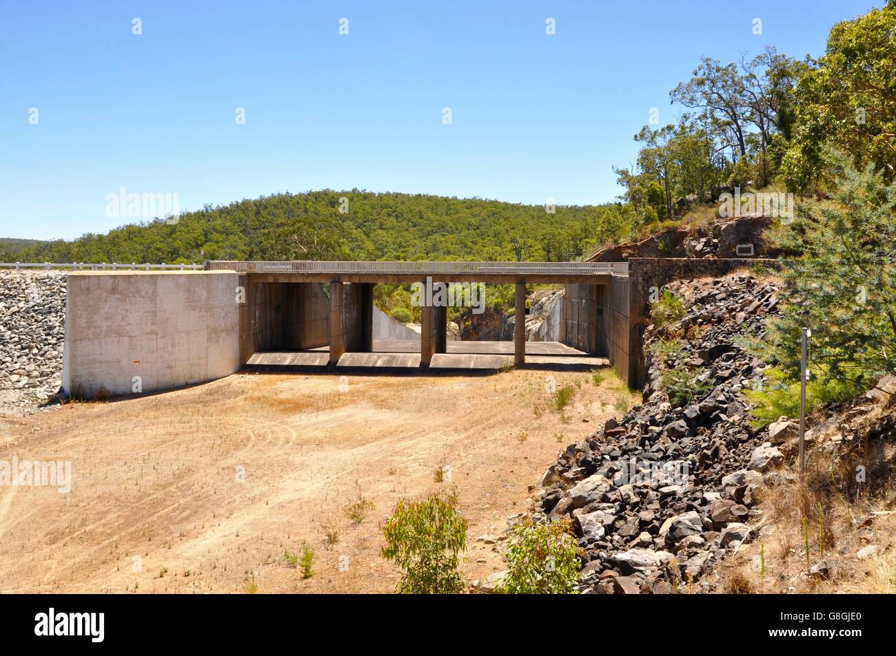 Serpentine Dam spillway in Serpentine National Park with lush greenery