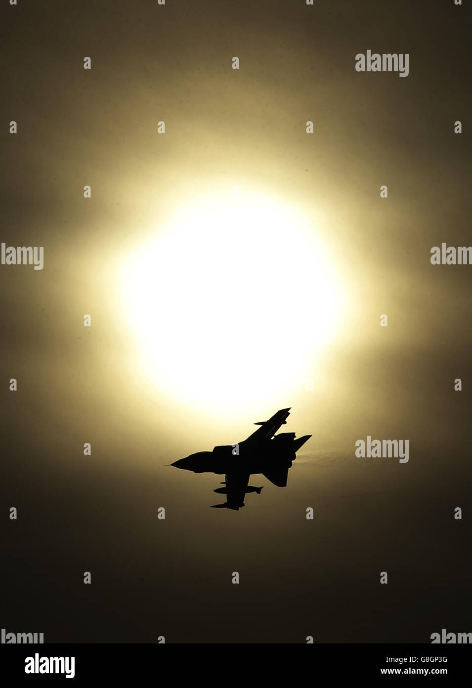 A Tornado jet flying past the sun after taking off from RAF Lossiemouth in Scotland, as RAF Tornado jets carried out the first British bombing runs over Syria, the Ministry of Defence has confirmed. Picture date: Thursday December 3, 2015. The air strikes were carried out within hours of a vote by MPs in the Commons to back extending operations against Islamic State (IS) from neighbouring Iraq. See PA story POLITICS Syria. Photo credit should read: Danny Lawson/PA Wire Stock Photo
