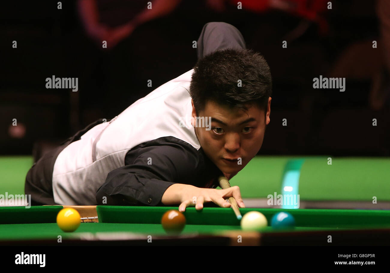 Liang Wenbo in action against Tom Ford during day nine of the 2015 Betway UK Snooker Championship at The York Barbican, York. Stock Photo
