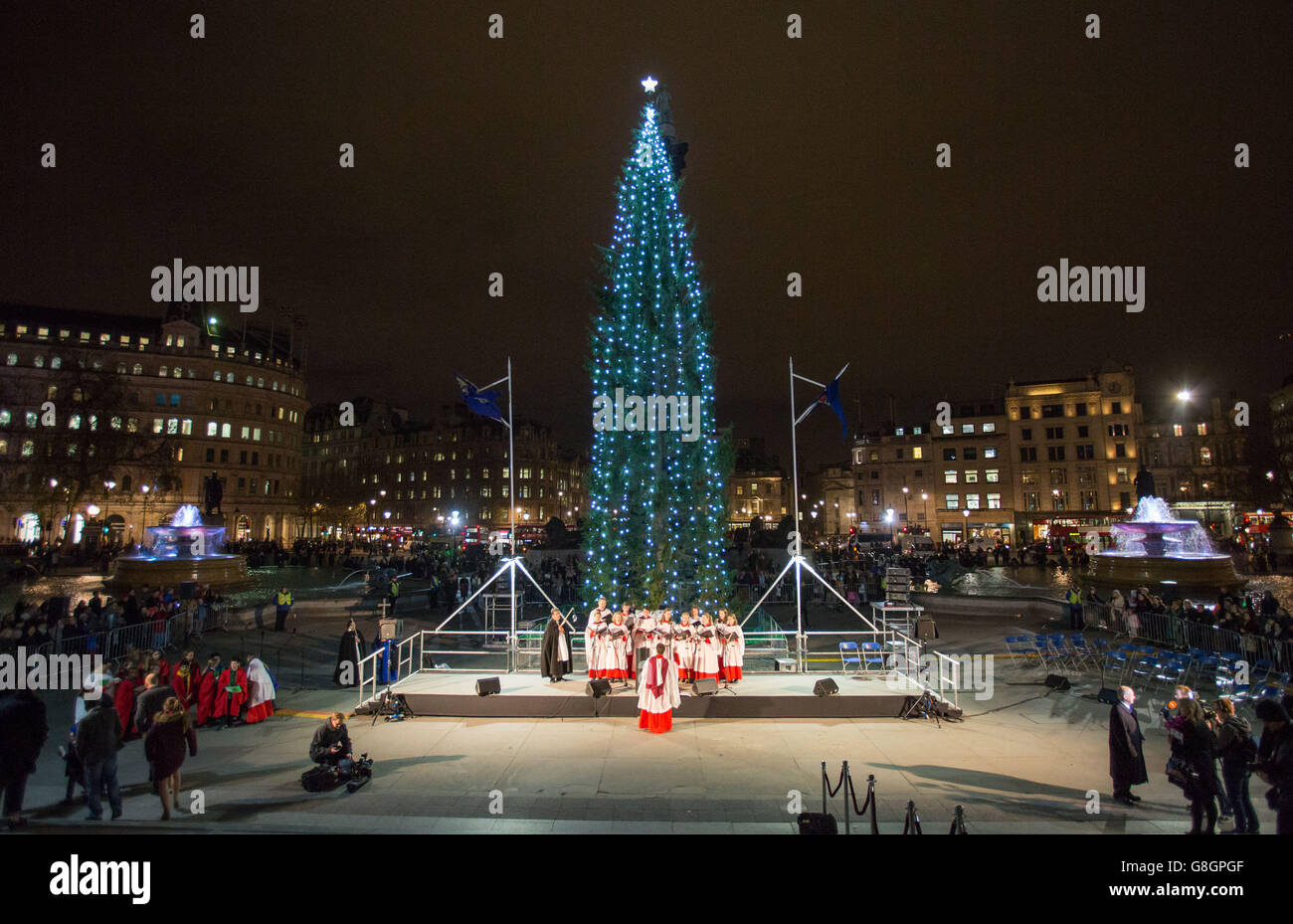 The lights on the Trafalgar Square Christmas tree are switched on during a ceremony in Trafalgar Square, London. Stock Photo