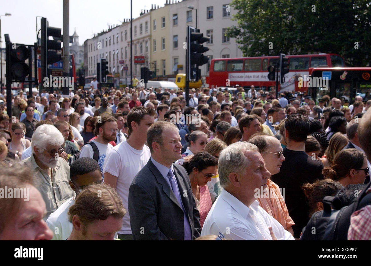 Members of the public fill the streets at the junction of Euston Road and Gray's Inn Road, outside London's King's Cross station during a two minute silence held across the UK in memory of the victims of last week's terror attacks on the capital which claimed 52 lives. Stock Photo