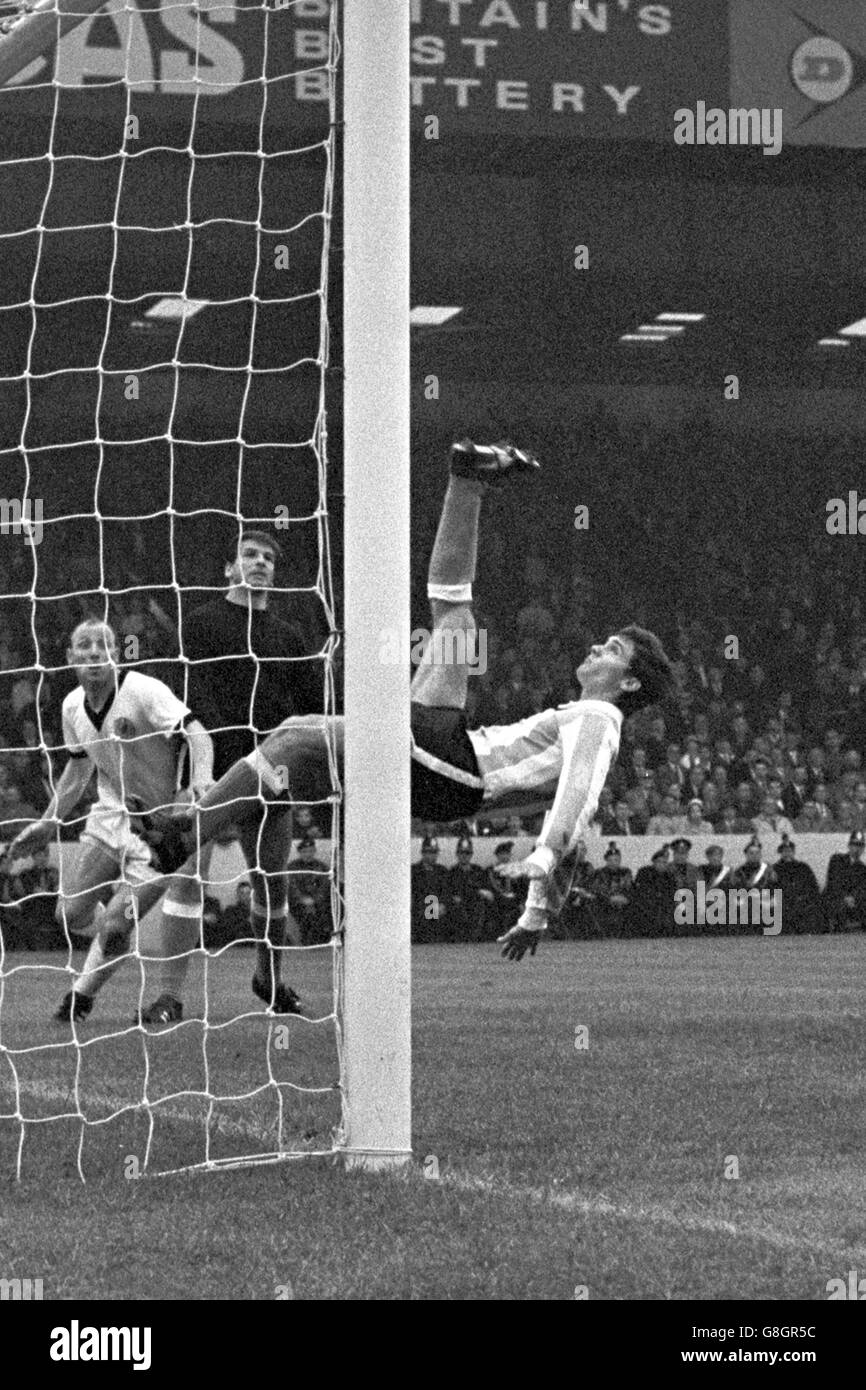 Argentina's Roberto Perfumo (r) clears off his own goal-line with a spectacular overhead kick, watched by goalkeeper Antonio Roma (c) and West Germany's Uwe Seeler (l) Stock Photo