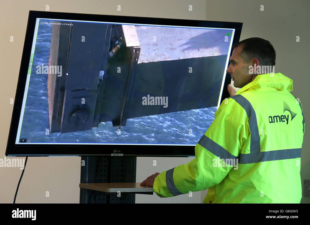 Amey chartered engineer Mark Arndt, who is in charge of the repair to the Forth Road Bridge, views a TV monitor showing a live picture of the crack discovered last week. Transport Minister Derek Mackay said that the repair remains 'on track' despite high winds which have hampered the efforts of engineers. Stock Photo