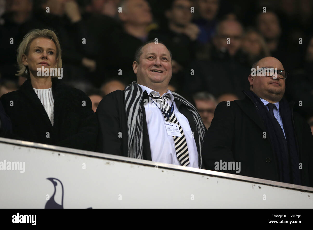 Newcastle United owner Mike Ashley (centre) and wife Linda Ashley (left) watch from the stands alongside Newcastle United chief executive Lee Charnley (right) during the Barclays Premier League match at White Hart Lane, London. Stock Photo
