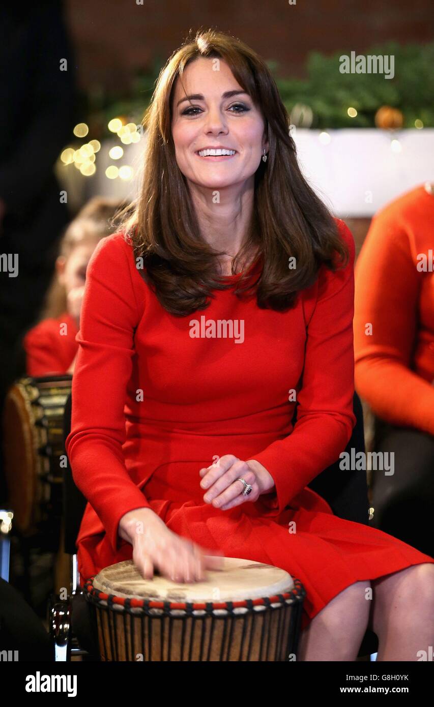 The Duchess of Cambridge takes part in a drumming music therapy session as she attends the Anna Freud Centre Family School Christmas party in north London. Stock Photo