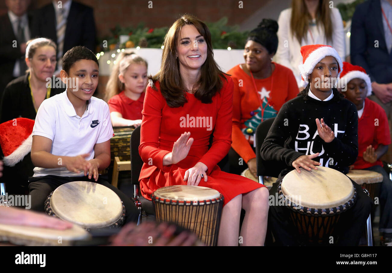 The Duchess of Cambridge takes part in a drumming music therapy session as she attends the Anna Freud Centre Family School Christmas party in north London. Stock Photo