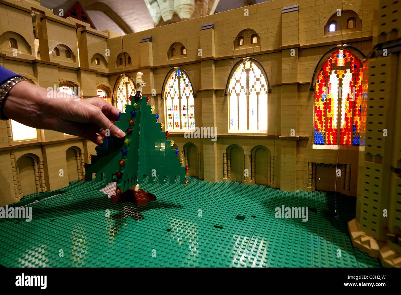 Shelagh Bainbridge adds lego to a model of Durham Cathedral where one LEGO  brick will be added for every &pound;1 donated to raise money for Open  Treasure at Durham Cathedral Stock Photo -