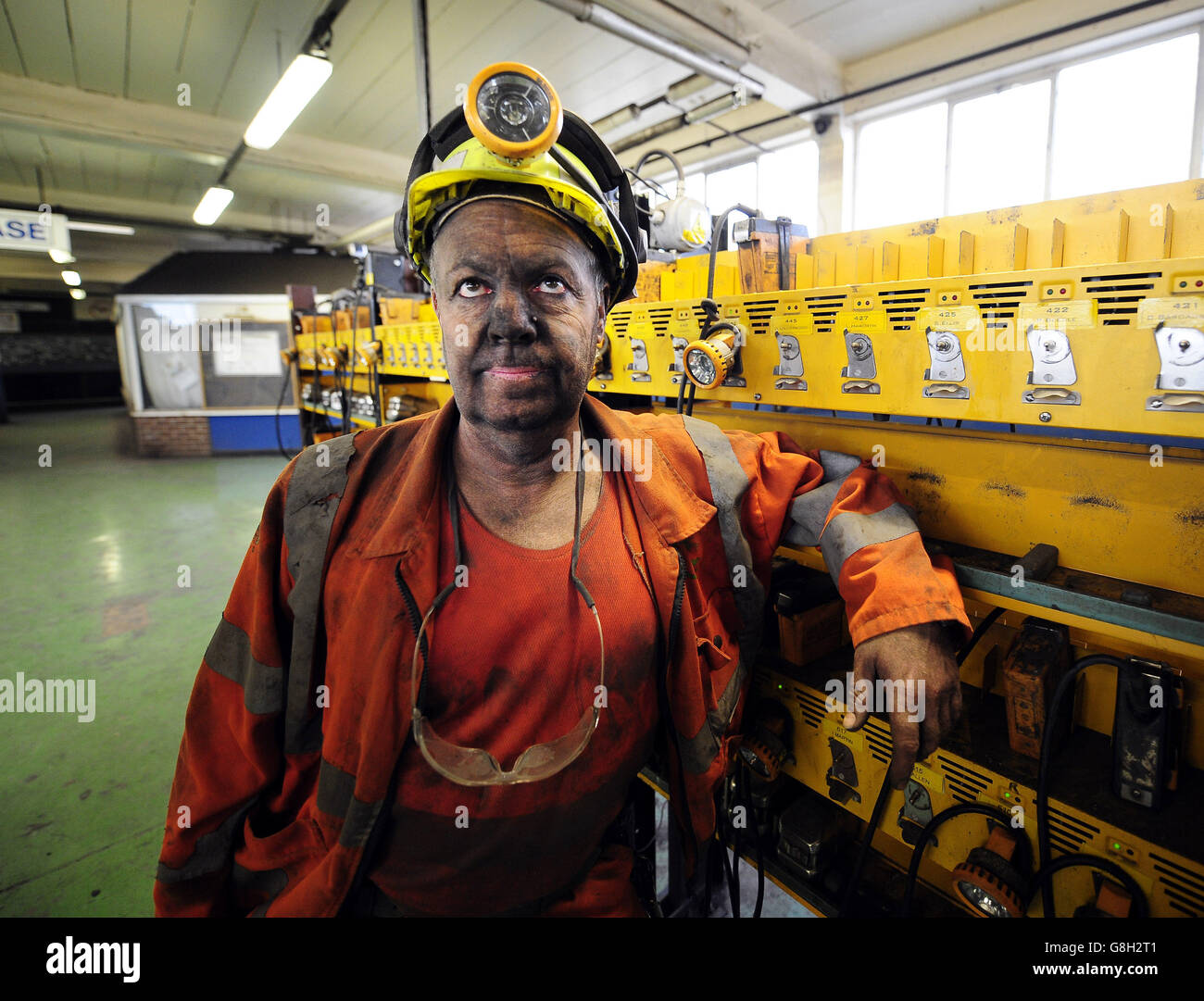 Miner Phil Kelsey, who has worked at Kellingley Colliery in Knottingley, North Yorkshire for 32 years, leaves the lamp room as the last shift finishes on the final day of production. Stock Photo