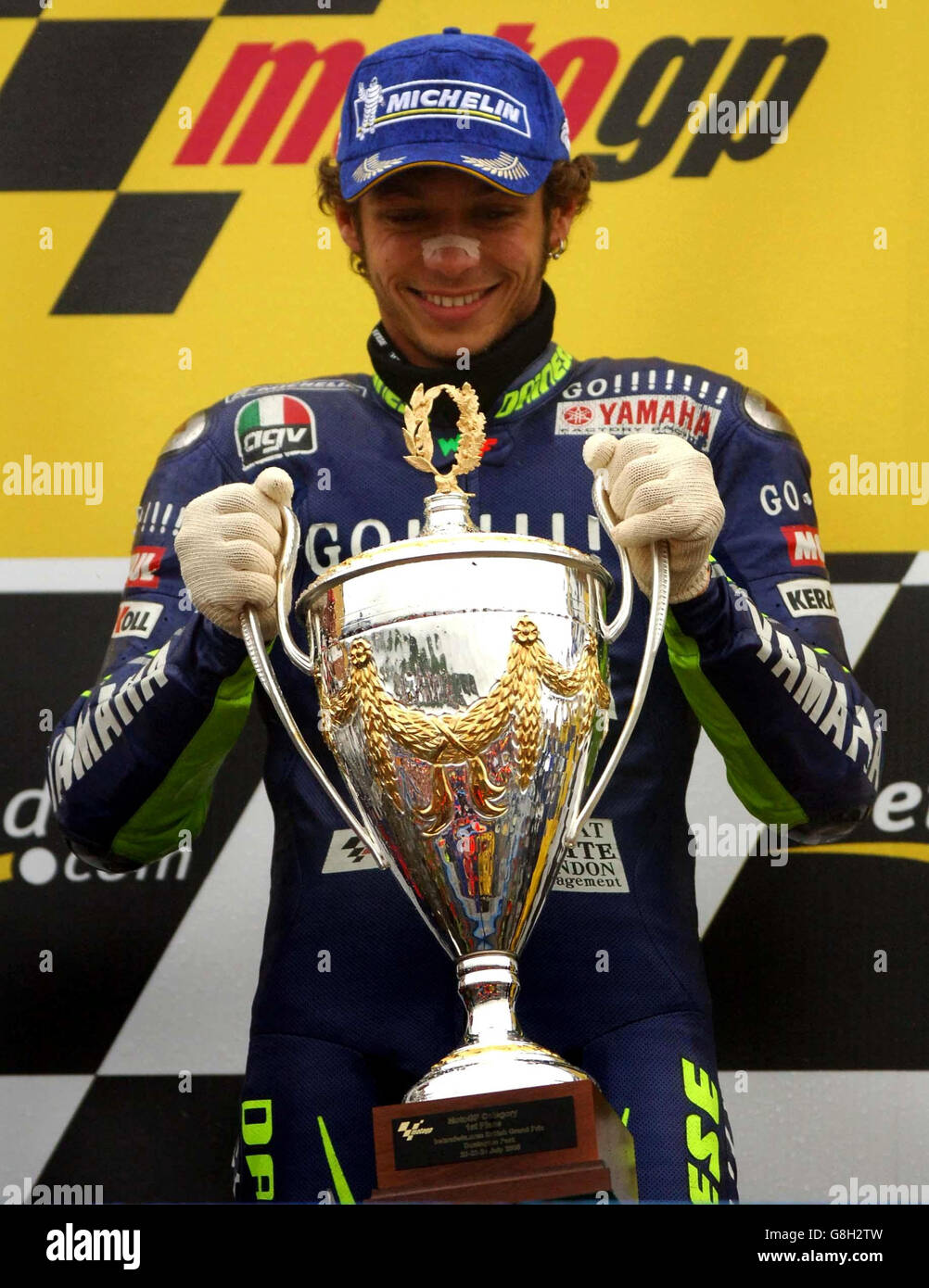 Italy's Valentino Rossi celebrates with the trophy after winning the  British Moto Grand Prix Stock Photo - Alamy